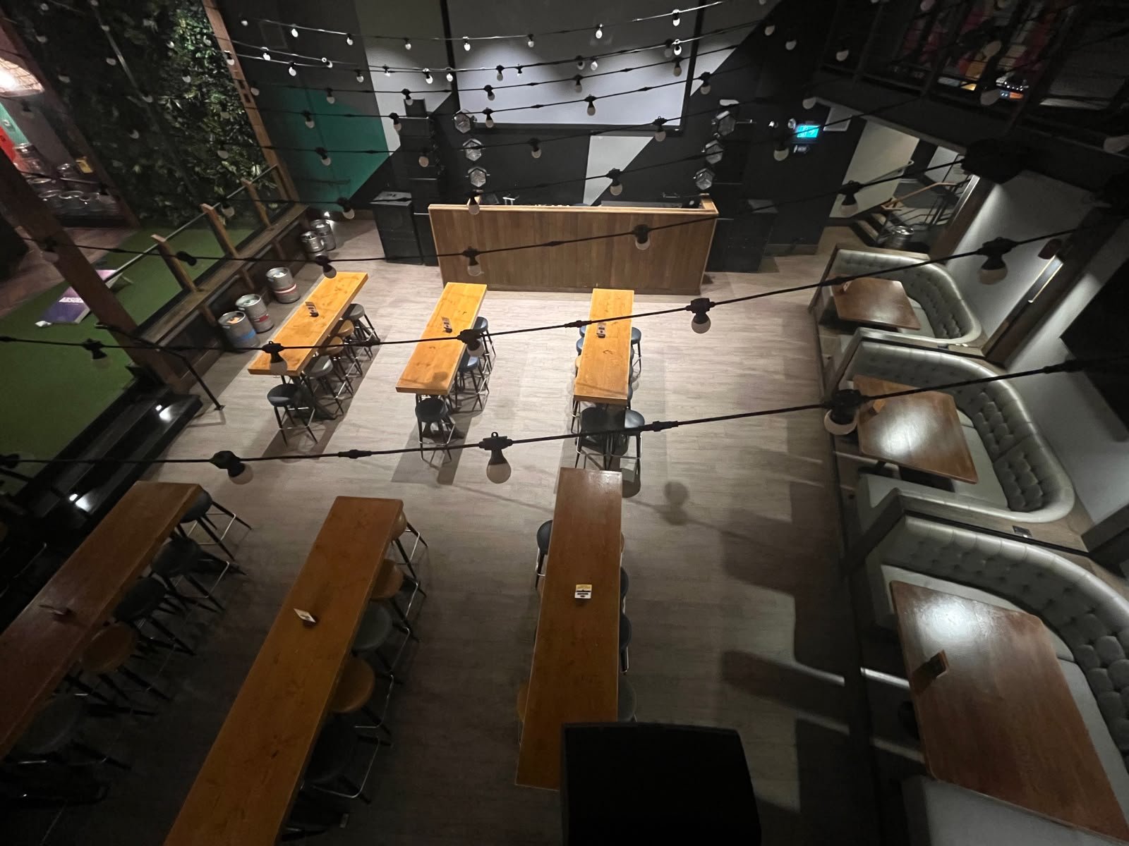 Second floor bar area with string lights