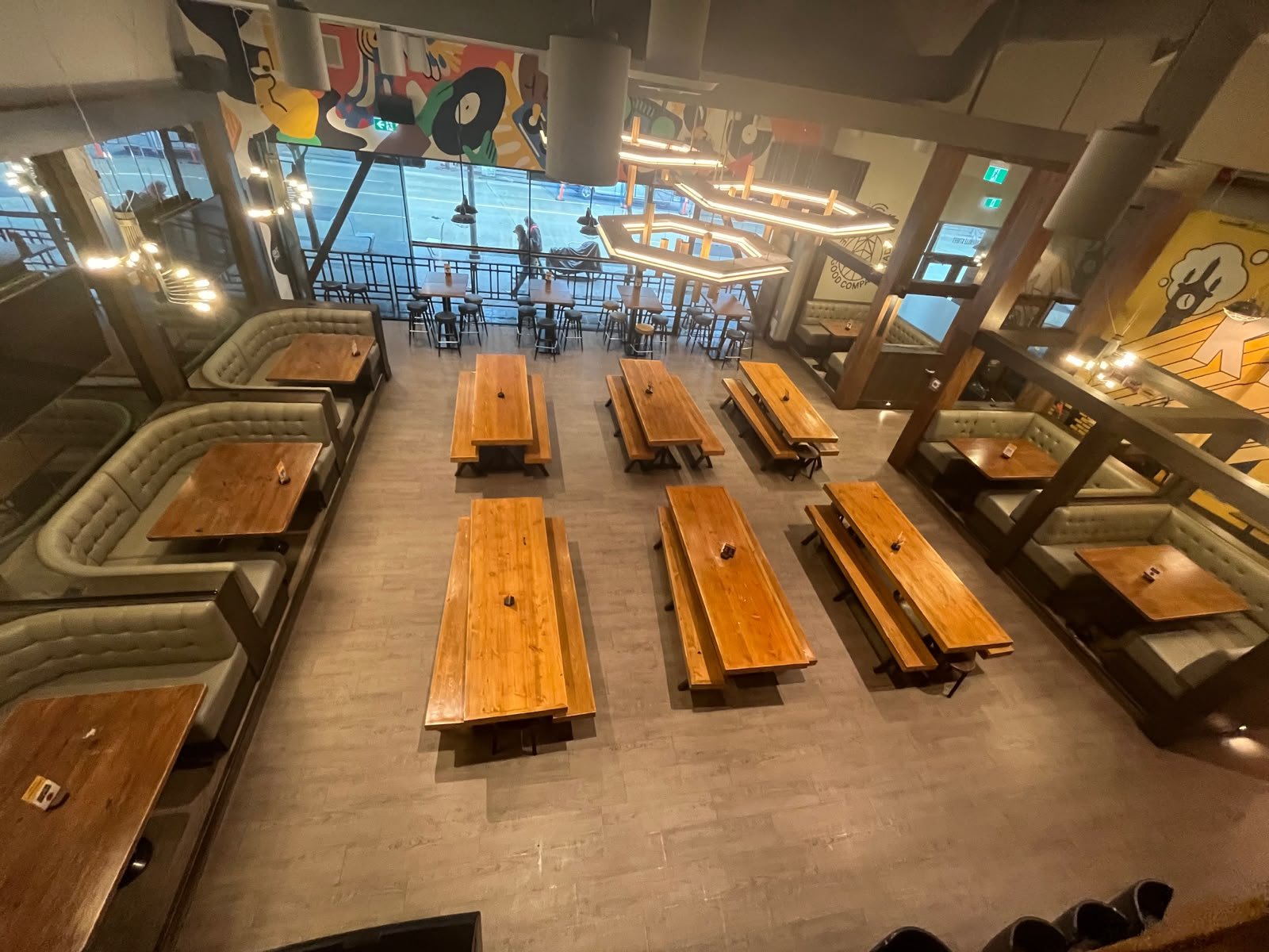 Main floor dining area with murals and communal seating